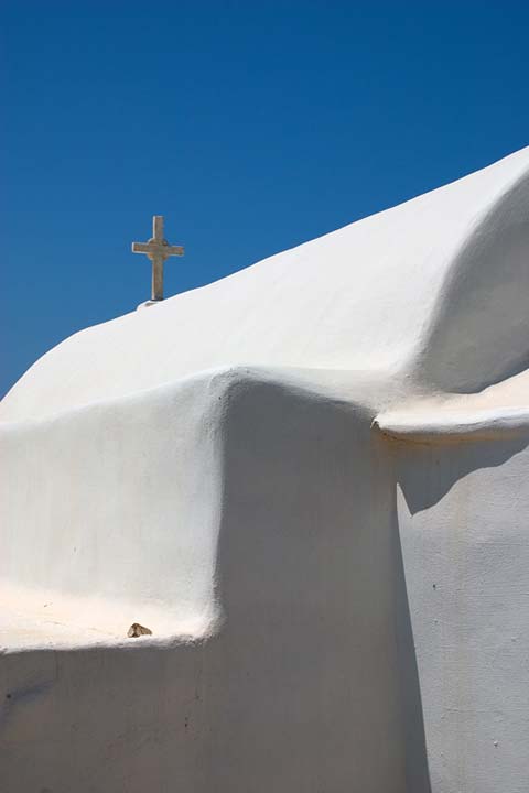 BLUE, WHITE AND A CROSS - A little chappel in the middle of nowhere in Paros. Just a part of it to show its simple form. by Nikos Bournas