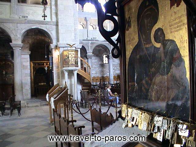 EKATONTAPYLIANI CHURCH - The oblations of the believers adorn the icons.