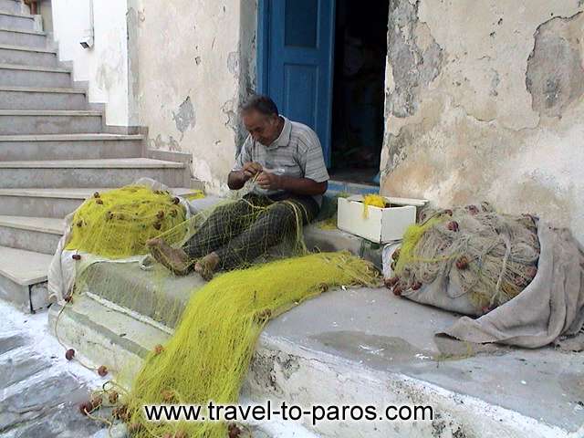 NAOUSSA FISHERMAN - The fisherman prepares his nets... 

